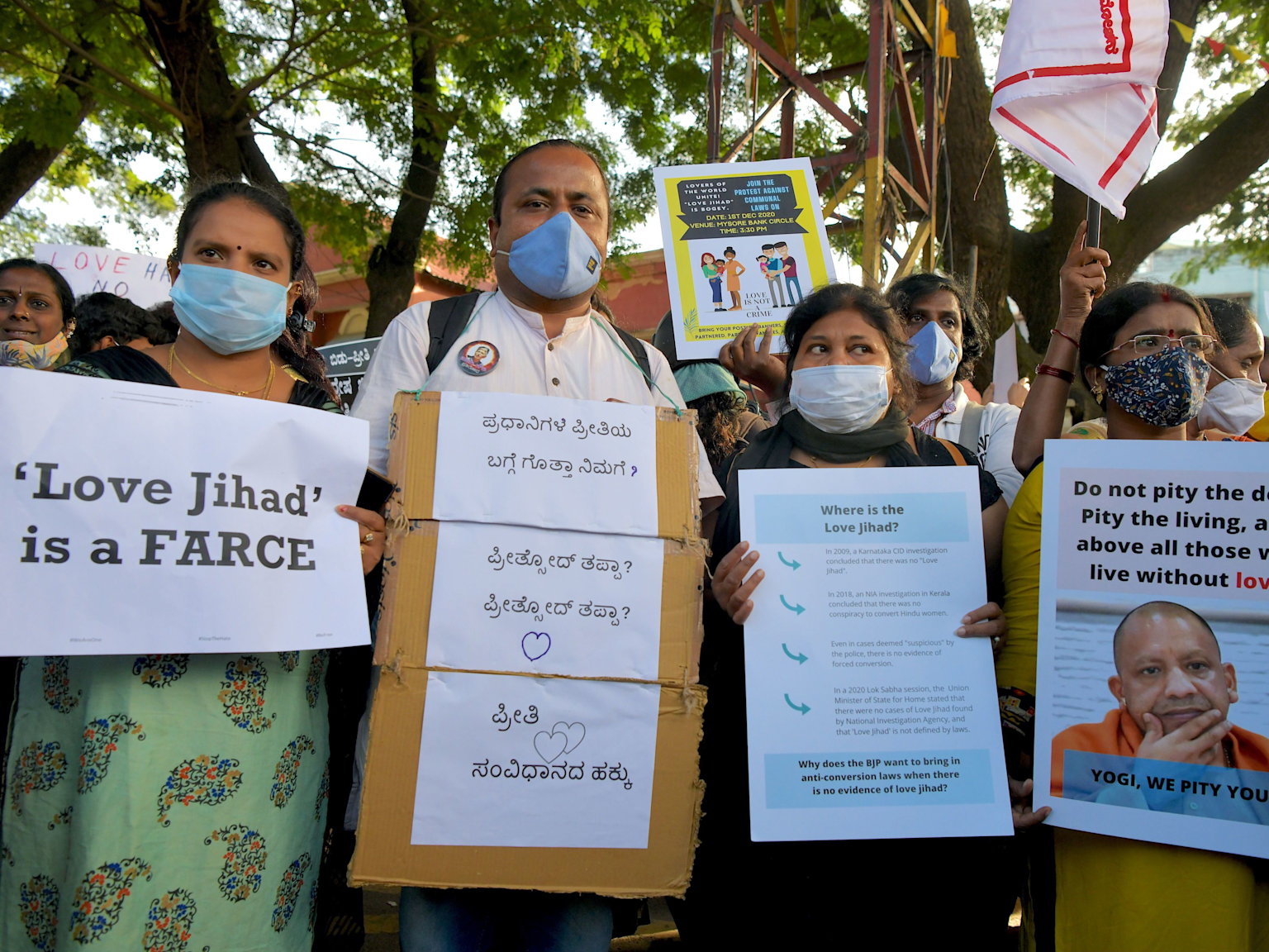 Protesters in India hold placards denouncing the concept of 'Love Jihad' and opposing anti-conversion laws
